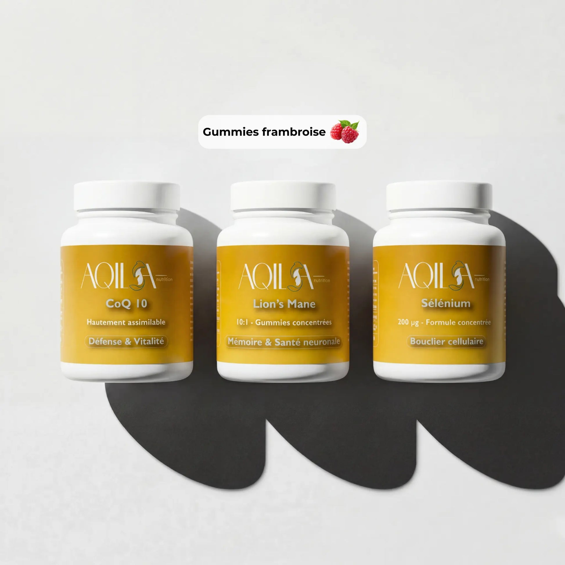 Flacons de la cure complète Immunité et Cerveau Aqila : CoQ10 300mg, Sélénium, et gummies au Lion's Mane saveur framboise.